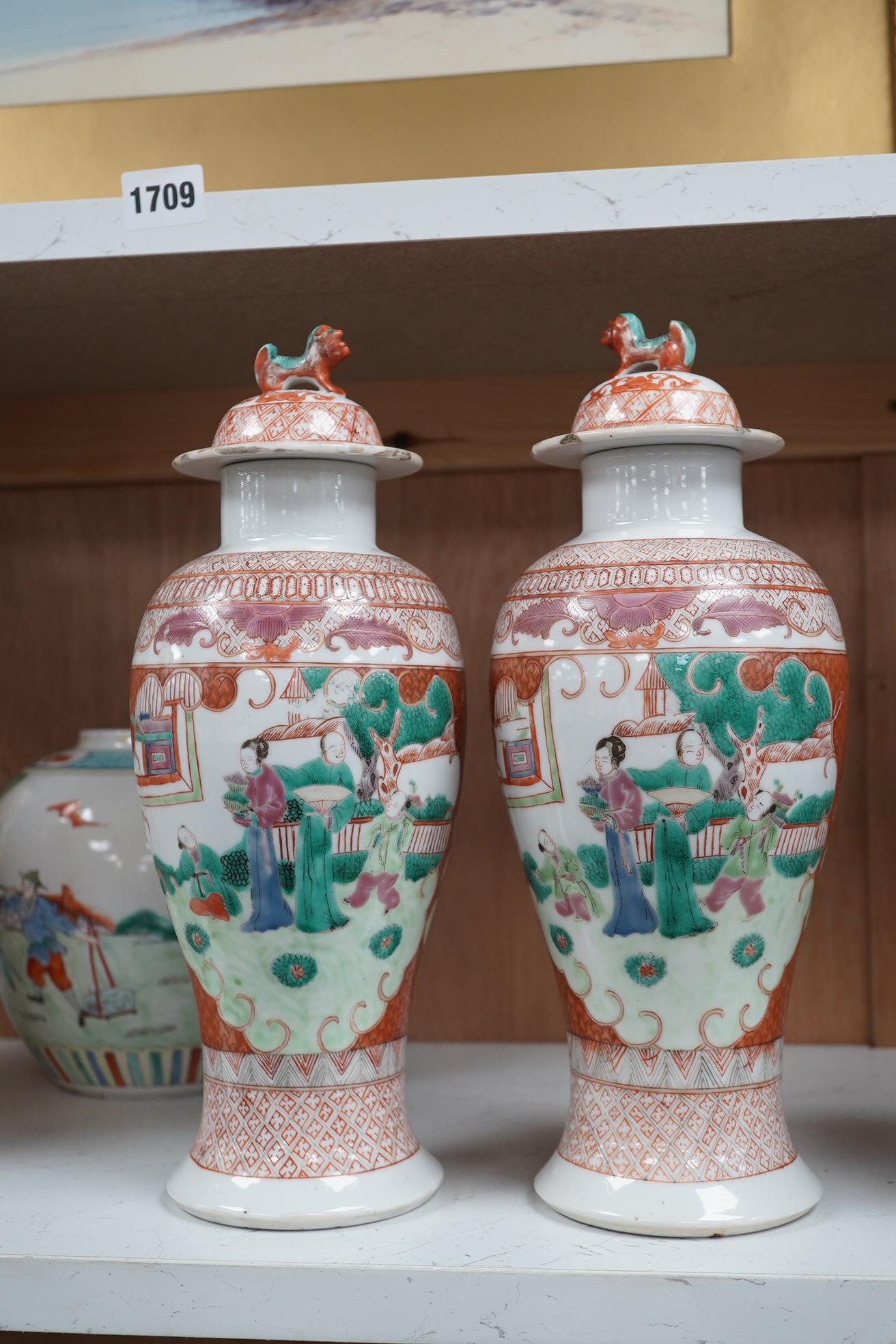 A group of Chinese ceramics to include a pair of early 20th century famille rose vases and covers, a 19th century blue and white crackle glazed vase etc, largest 31cm high. Condition - mostly fair, a few chips and cracks